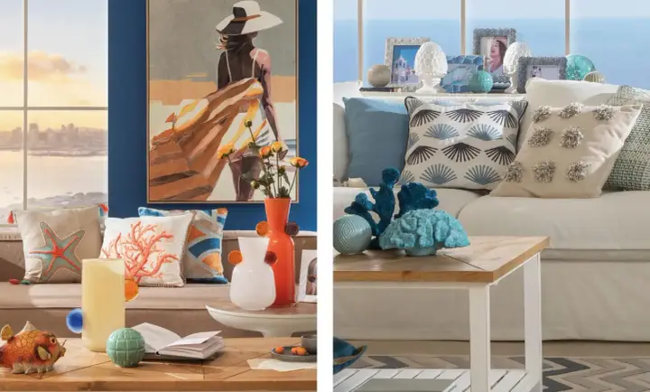 Un salotto con un quadro di una donna in spiaggia, cuscini a tema marino e decorazioni in corallo. Uno stile mediterraneo contemporaneo che evoca la brezza marina.