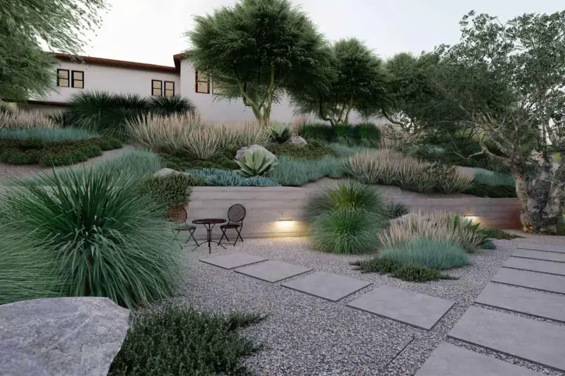 Un giardino moderno con ghiaia, piante succulente e graminacee. Idee originali per un giardino con ghiaia, con un piccolo tavolo e sedie per godersi la tranquillità.